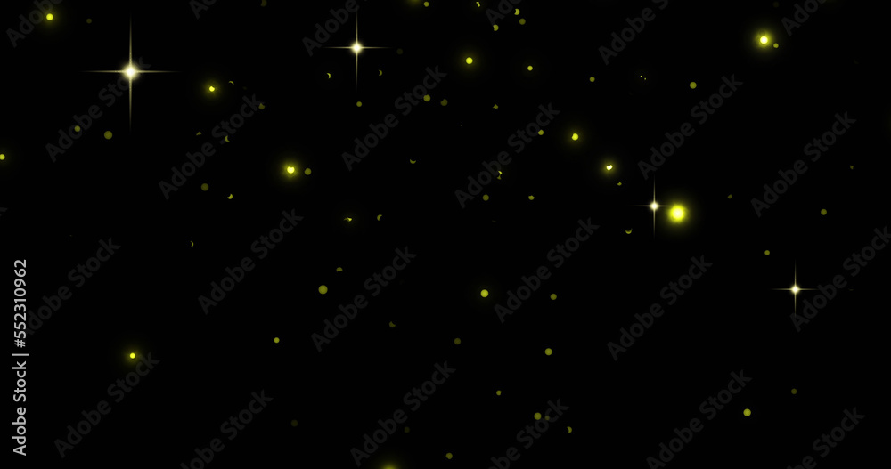 Image of glowing yellow spots falling on black background Image of glowing yellow spots falling on black background