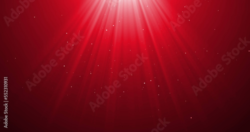 Image of falling confetti and light rays over red background photo