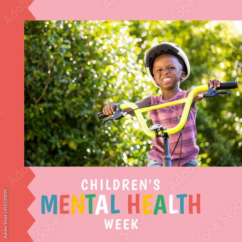 Composition of children's mental health week text and boy on bike