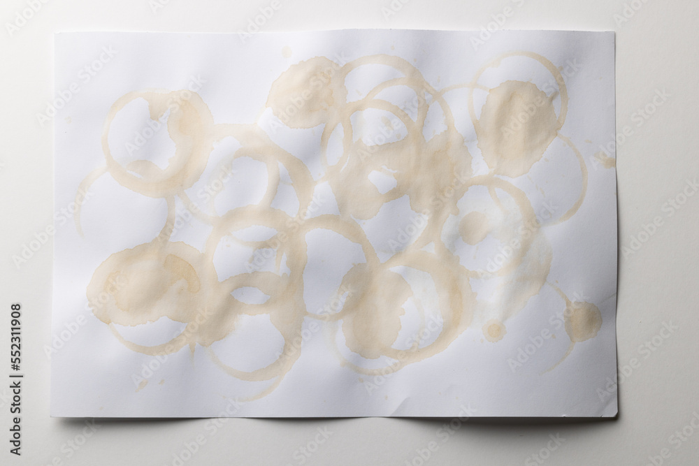 White stained piece of paper with copy space on white background
