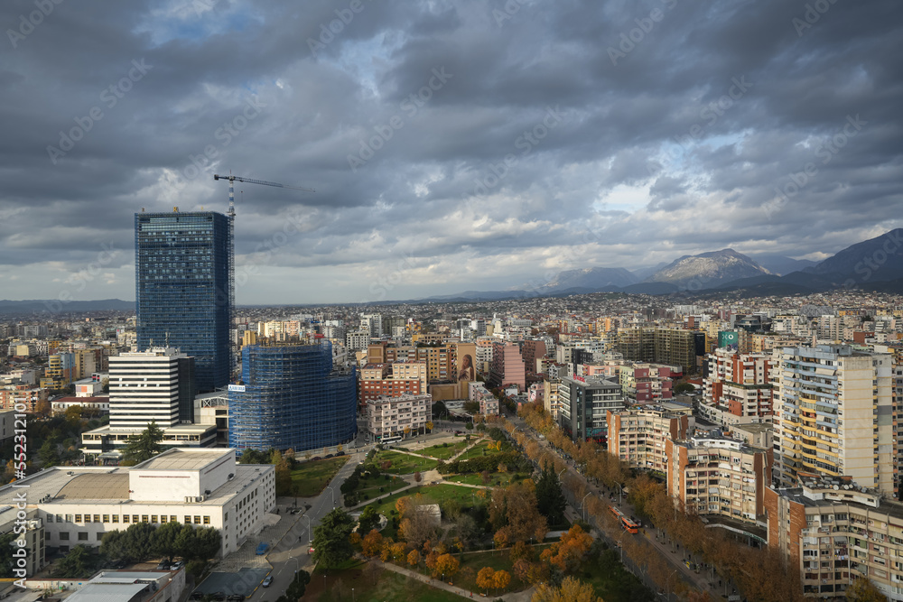 Obraz premium Tirana from above. Wide angle aerial view with the city center of Tirana city during a cloudy day in Albania, 2022.