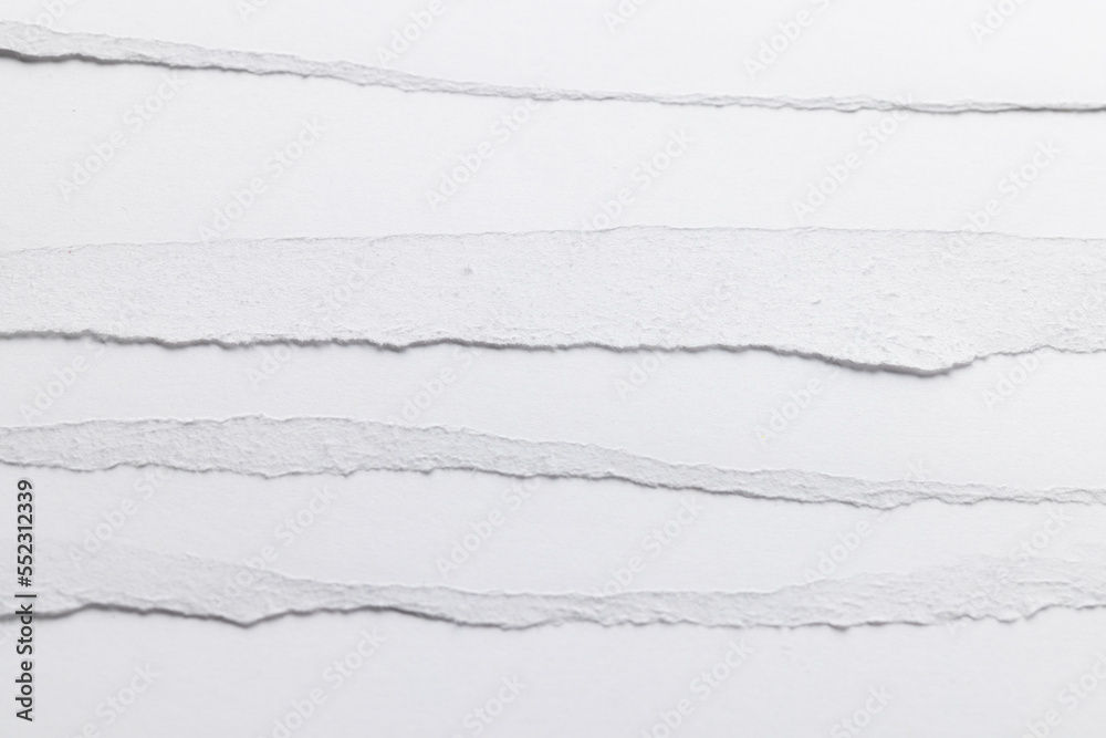 Ripped up pieces of white paper with copy space on white background Ripped up pieces of white paper with copy space on white background