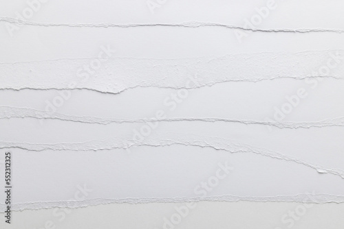 Ripped up pieces of white paper with copy space on white background