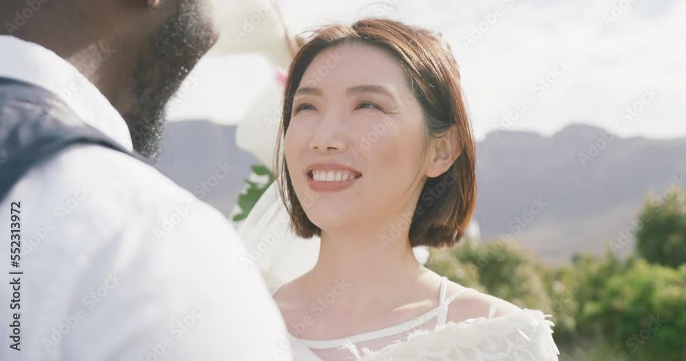 Video of happy diverse bride and groom smiling at each other at outdoor wedding Video of happy diverse bride and groom smiling at each other at outdoor wedding