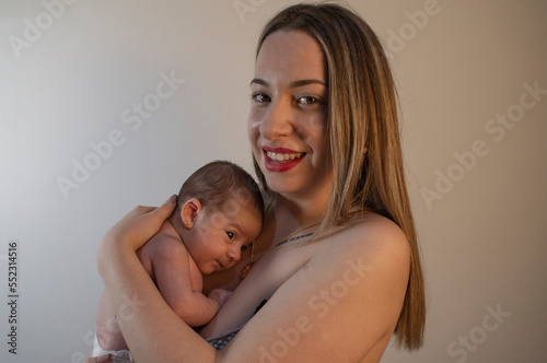 Baby in mother's arms. photo