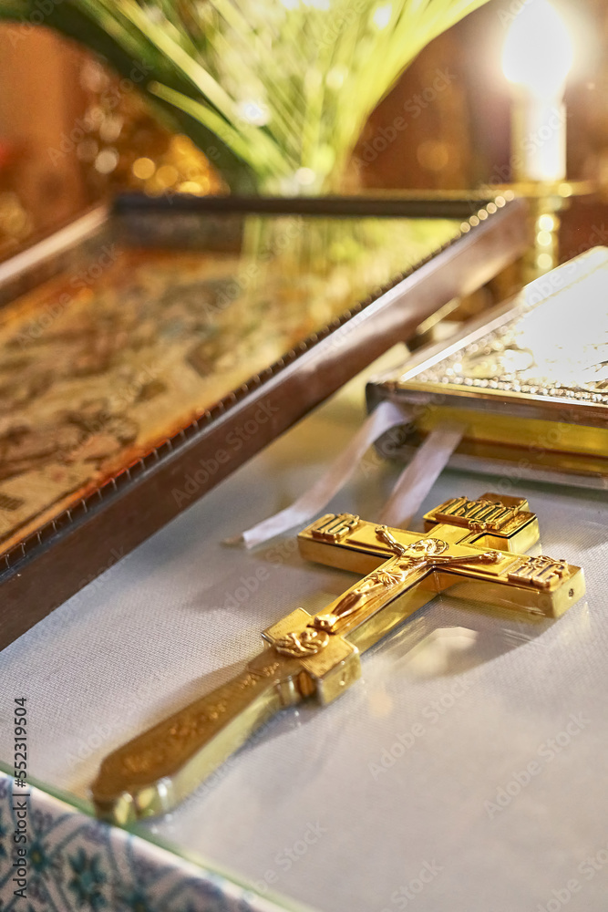 Fototapeta premium On the throne in the church lies a cross with a crucifix.