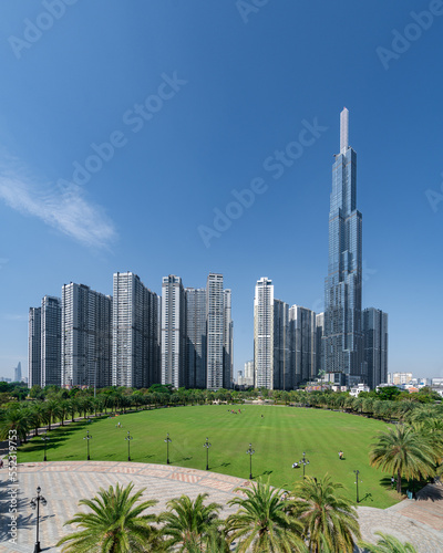 Beautiful blue sky view at Landmark 81 is a super tall skyscraper in center Ho Chi Minh City, Vietnam and Saigon bridge with development buildings, energy power infrastructure. 