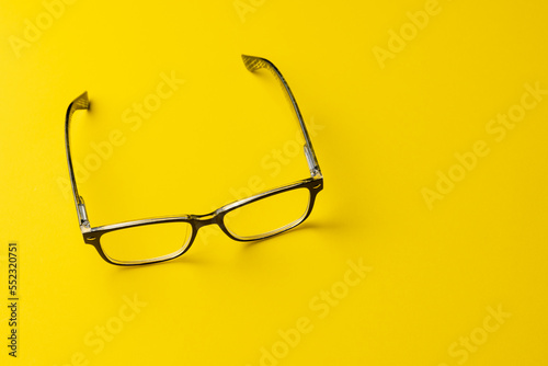 Composition of glasses on yellow background