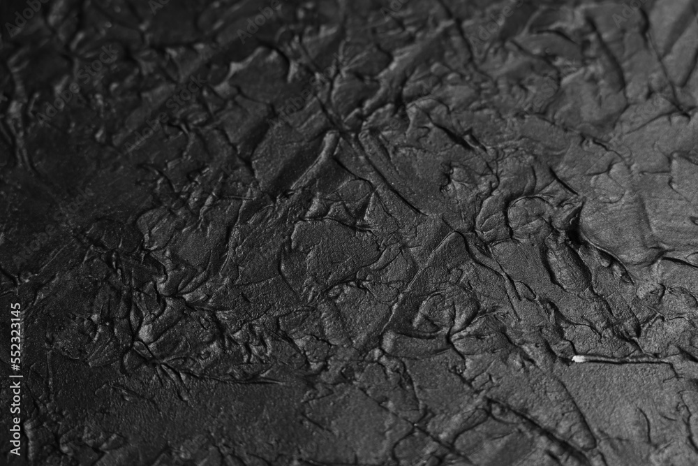 Uneven black design board photographed from the top. Uneven black design board photographed from the top.