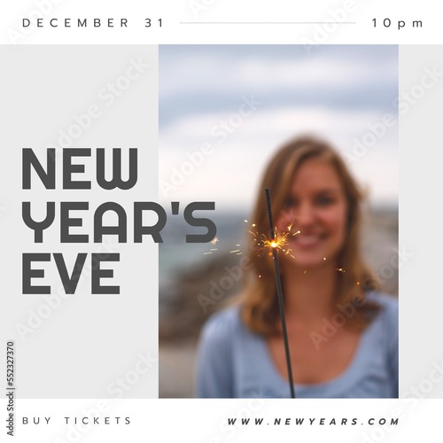 Composition of happy new years eve text over caucasian woman with sparkler