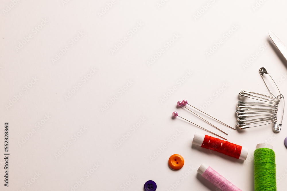 Composition of sewing equipment on white background