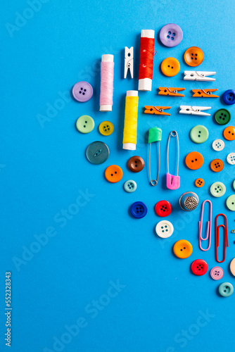 Composition of sewing equipment on blue background