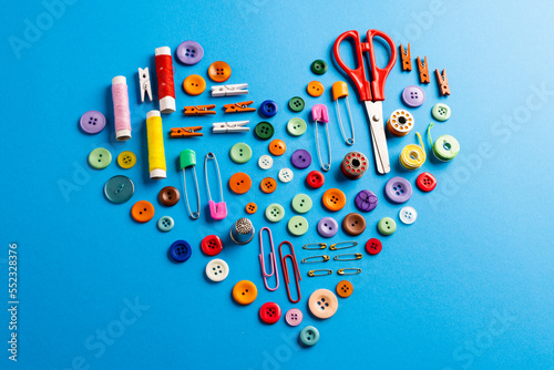 Composition of sewing equipment on blue background