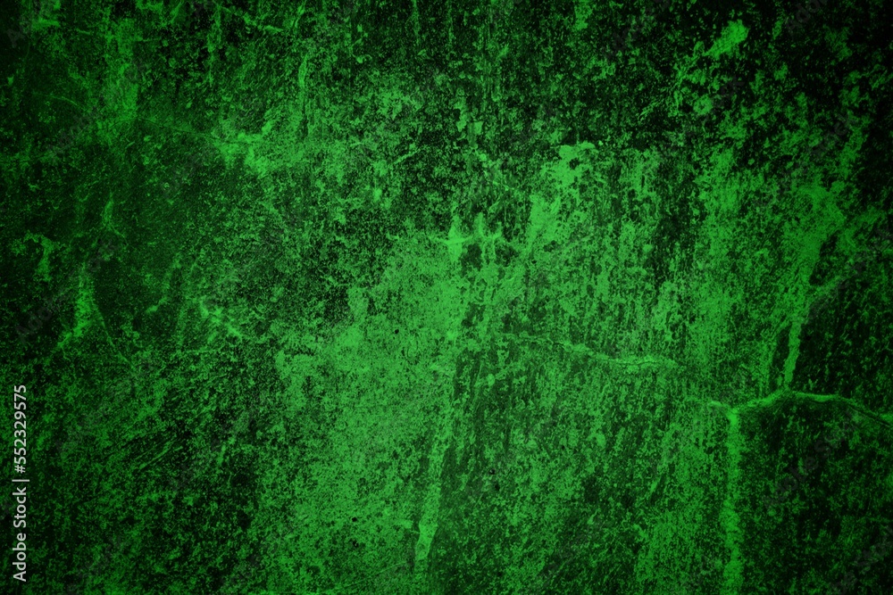 green textured wall background with dark side, green granite stone wall