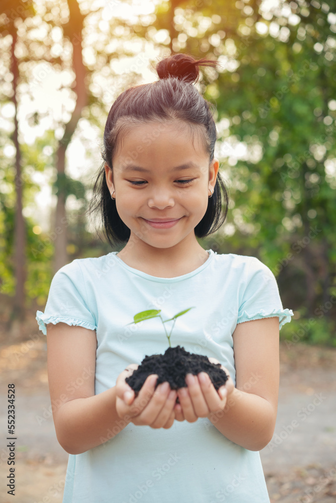 hands holding young plant with soil.World environment day and sustainable environment concept