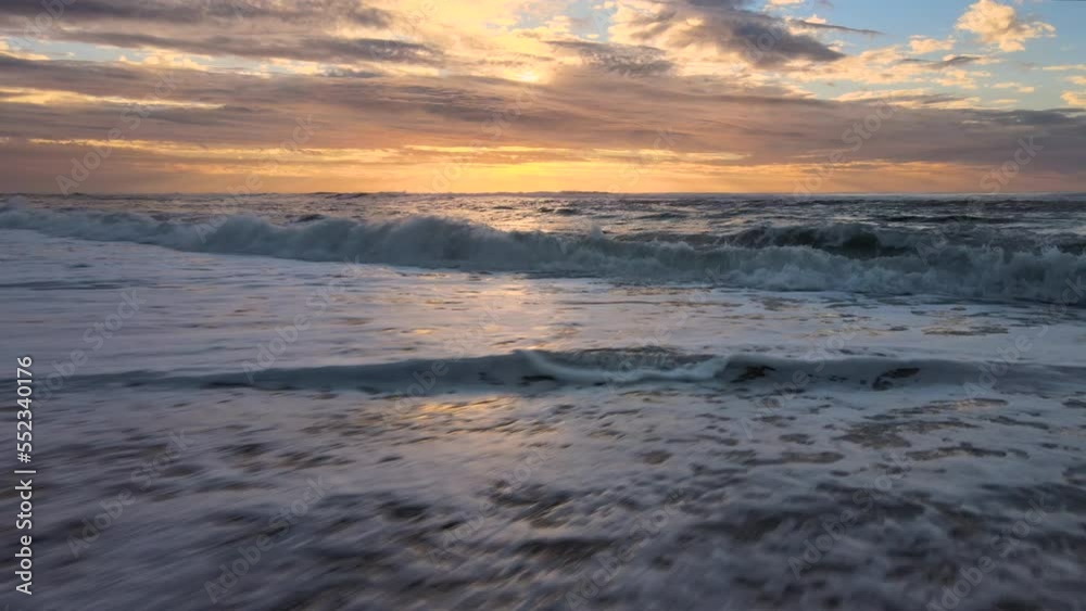 Beautiful evening View on waves on the empty coast of the Atlantic Ocean. Deserted beautiful evening sunset ocean beach. 4k resolution video. Beautiful evening View on waves on the empty coast of the Atlantic Ocean. Deserted beautiful evening sunset ocean beach. 4k resolution video.