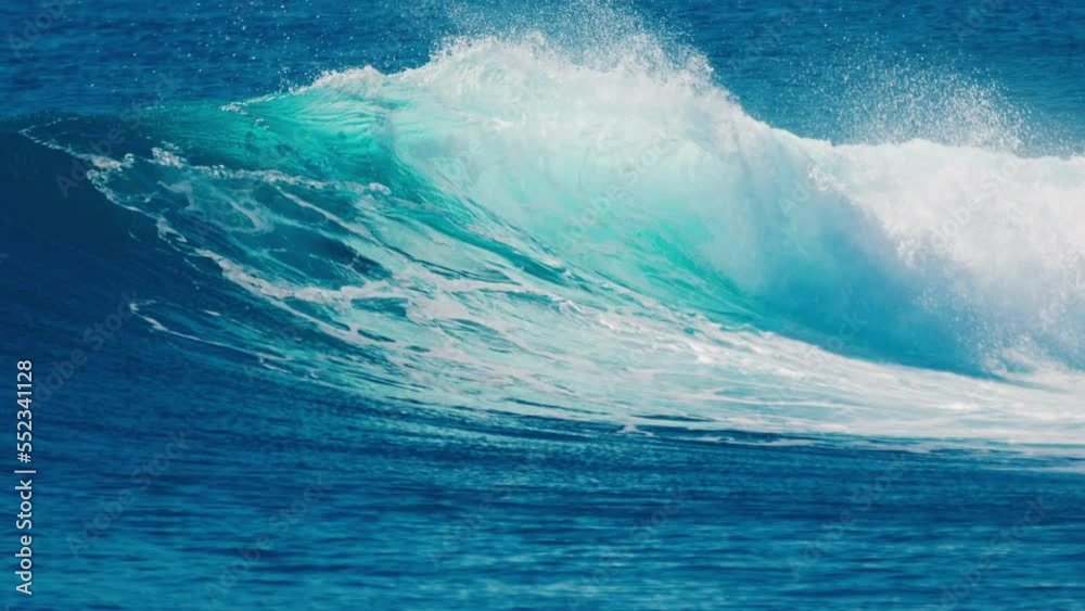 Powerful crystal clear ocean wave breaks on the shore in the Maldives Powerful crystal clear ocean wave breaks on the shore in the Maldives