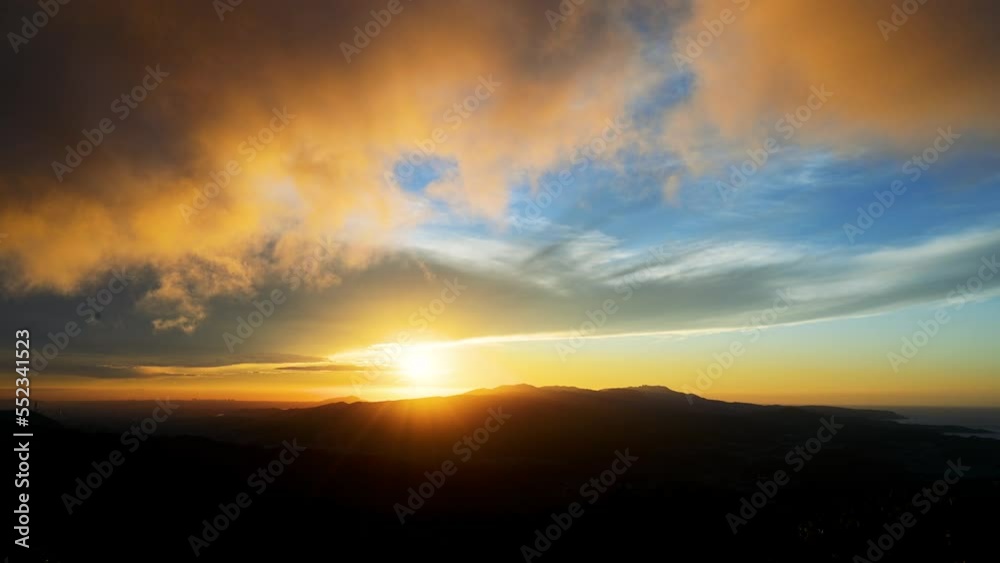 Enjoy a romantic colorful sunset from the top of the mountain. Blue sky orange evening sunset. Wufen Mountain, Ruifang District, New Taipei City, Taiwan Enjoy a romantic colorful sunset from the top of the mountain. Blue sky orange evening sunset. Wufen Mountain, Ruifang District, New Taipei City, Taiwan