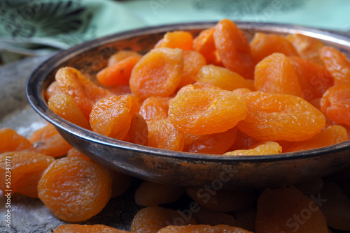 Dried apricots on plate.   photo