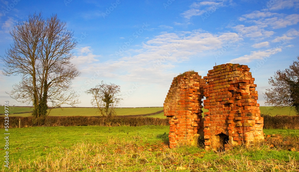 Remains of farm building in English countryside