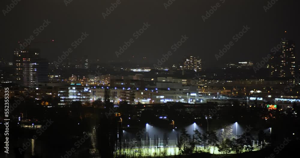 Real time panning video of nighttime Zurich city, Switzerland. High viewpoint, moving traffic, right to left slow pan, no people Real time panning video of nighttime Zurich city, Switzerland. High viewpoint, moving traffic, right to left slow pan, no people