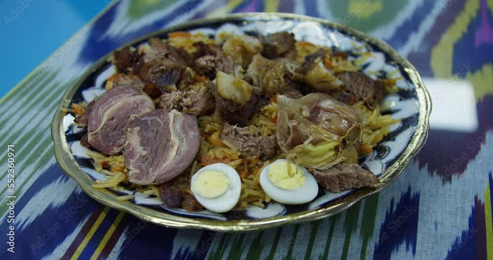 Plate with tasty pilaf on the table Plate with tasty pilaf on the table