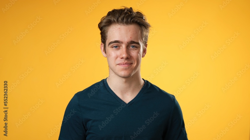 Portrait of smiling happy young hipster man 20s isolated on solid yellow background with copy space in studio Portrait of smiling happy young hipster man 20s isolated on solid yellow background with copy space in studio