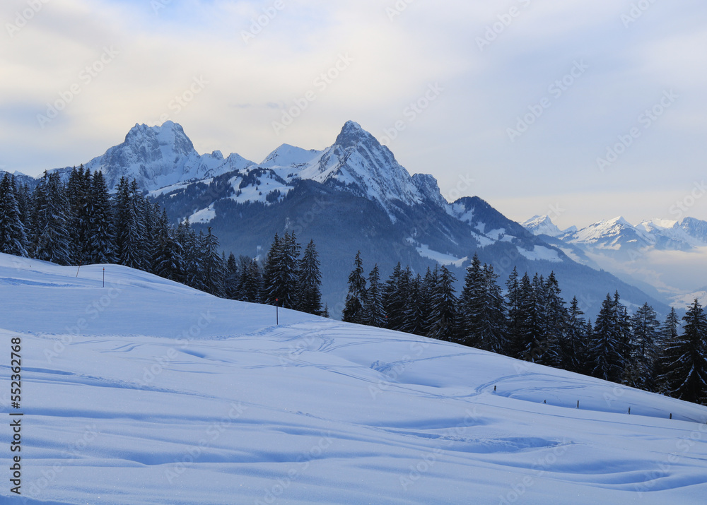 Winter evening in the Saanenland Valley, Switzerland.