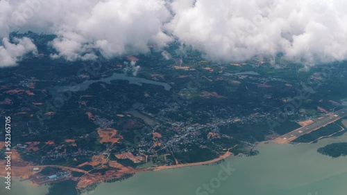 Wallpaper Mural Window airplane plane view white clouds sky sea ocean coast approach malaysia asia Torontodigital.ca