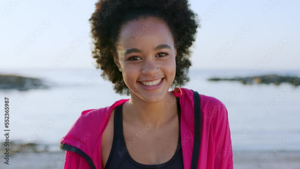 Face, beach and happy black woman on vacation, holiday or trip. Portrait, beauty and female from South Africa relaxing by ocean coast or seashore, having fun and enjoying quality time alone outdoors. Face, beach and happy black woman on vacation, holiday or trip. Portrait, beauty and female from South Africa relaxing by ocean coast or seashore, having fun and enjoying quality time alone outdoors.