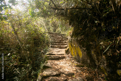 Walking towards the city of Machu Picchu by the Inca trail. Stone staircase.