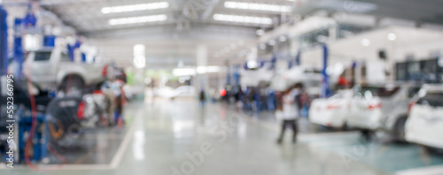 Photographie car service centre auto repair workshop blurred panoramic background