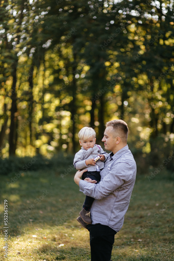 happy family playing and laughing in autumn park