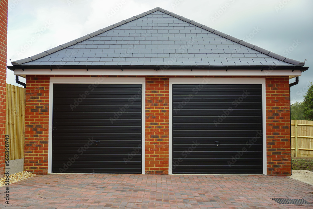 twin garages for new build homes. double garage exterior on new residential estate. 