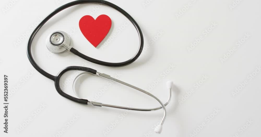 Video of stethoscope with red heart on white background with copy space Video of stethoscope with red heart on white background with copy space