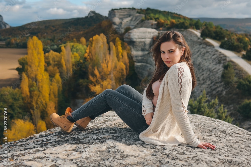 Beautiful girl posing in nature. Autumn photo session in nature.