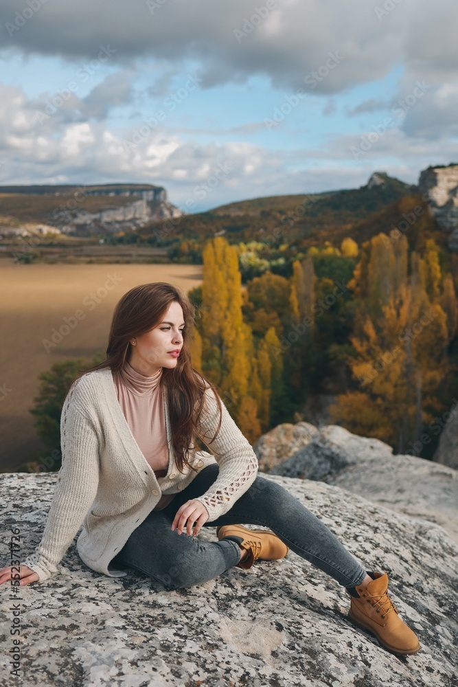 Beautiful girl posing in nature. Autumn photo session in nature.