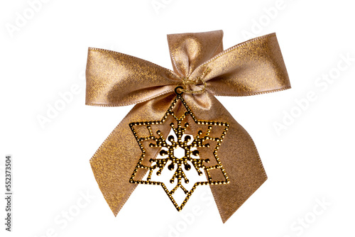Gift bows. Closeup of a decorative golden ribbon bow made of silk for gift box isolated on a white background. Decorations background with star. Clipping path. Macro photograph.