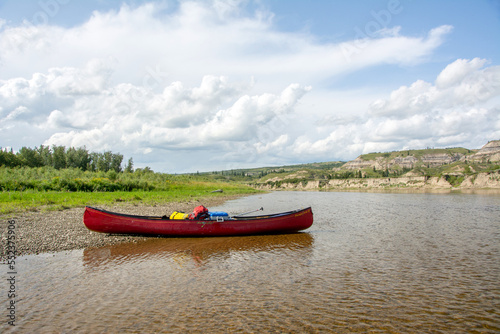 Canoe on banks of Red Deer River, Alberta