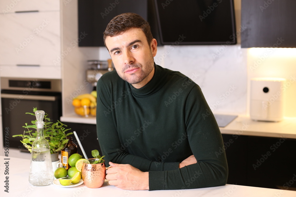 Man preparing a Moscow mule cocktail in copper cup Man preparing a Moscow mule cocktail in copper cup