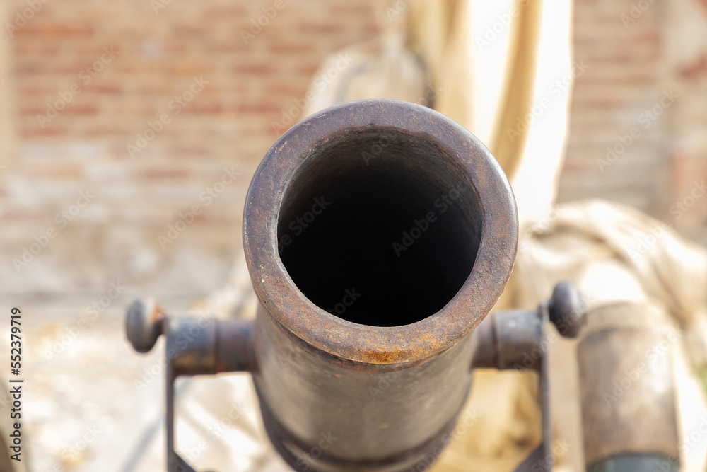 macro photography in closeup of the muzzle of an ancient 16th century cannon