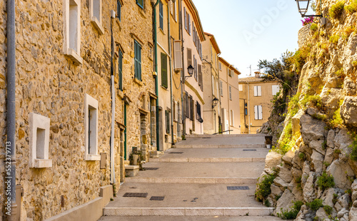 Rue Barque en Cannes street with medieval stone vintage houses in historic old town of Antibes resort city onshore Azure Cost of Mediterranean Sea in France