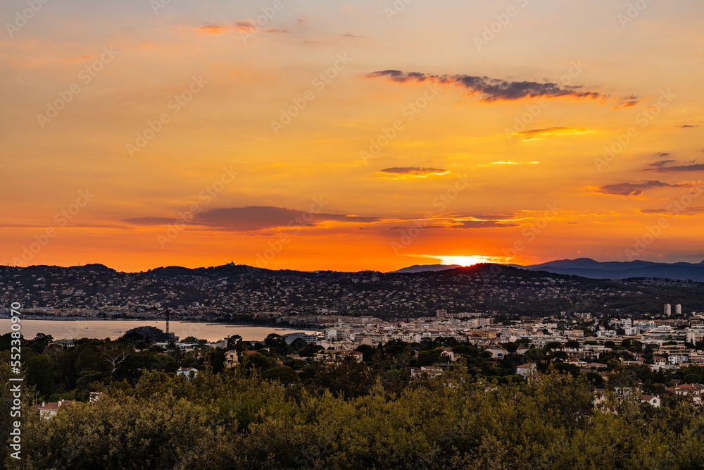 Panoramic sunset Juan Les Pins harbor and district of Antibes resort city onshore Azure Cost of Mediterranean Sea in France Panoramic sunset Juan Les Pins harbor and district of Antibes resort city onshore Azure Cost of Mediterranean Sea in France