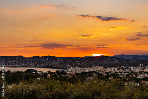 Panoramic sunset Juan Les Pins harbor and district of Antibes resort city onshore Azure Cost of Mediterranean Sea in France photo