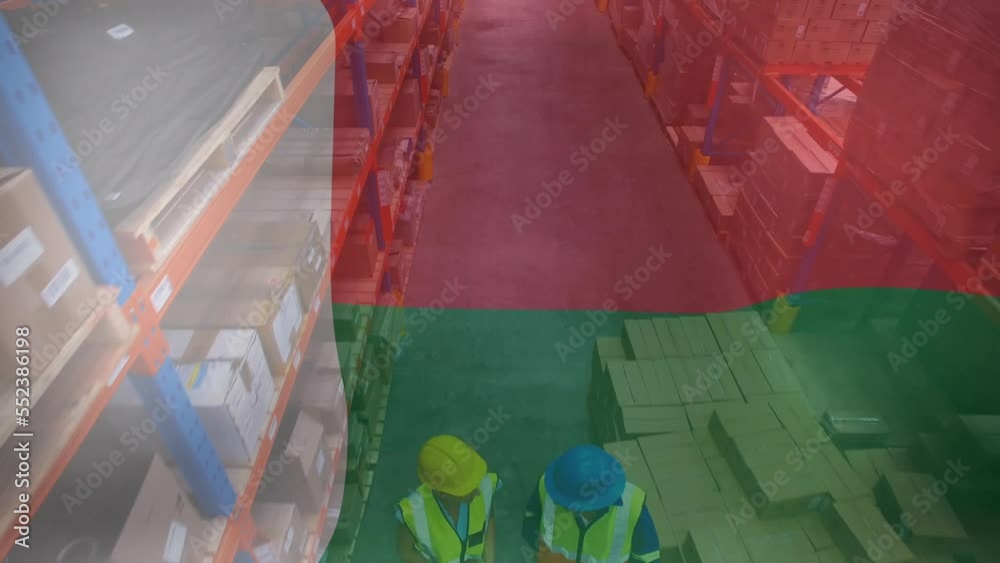 Animation of flag of madagascar over diverse workers in warehouse
