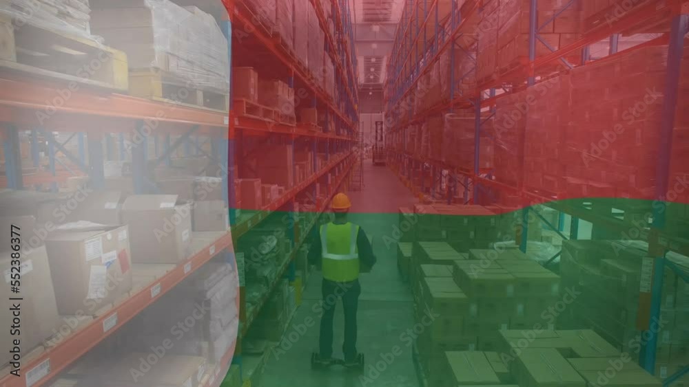 Animation of flag of madagascar over caucasian male worker in warehouse