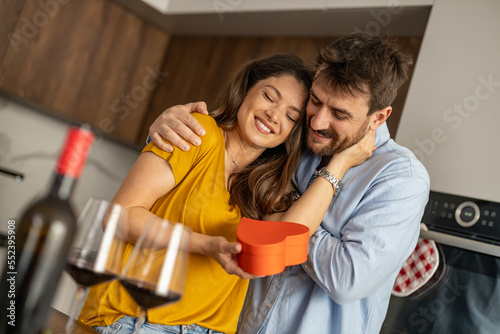 Couple drinking red wine at home
