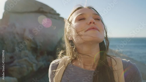 Woman, hiker and relax on beach breathing for calm freedom, peace and summer travel vacation. Hiking, ocean sea and positive mindset motivation or mind wellness on holiday breakin nature outdoor