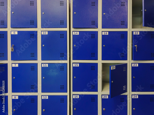Blue lockers in a public changing room or in a clothing store. A storage room in a supermarket.