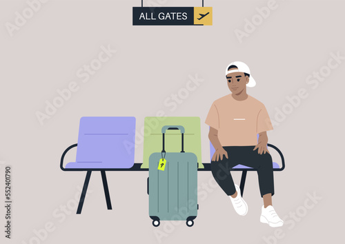 A passenger waiting for departure in the airport lounge with their cabin luggage, all gates sign hanging from the сeiling